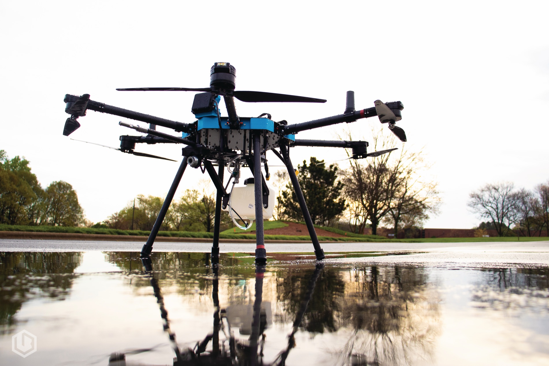A cleaning drone on wet ground at dusk