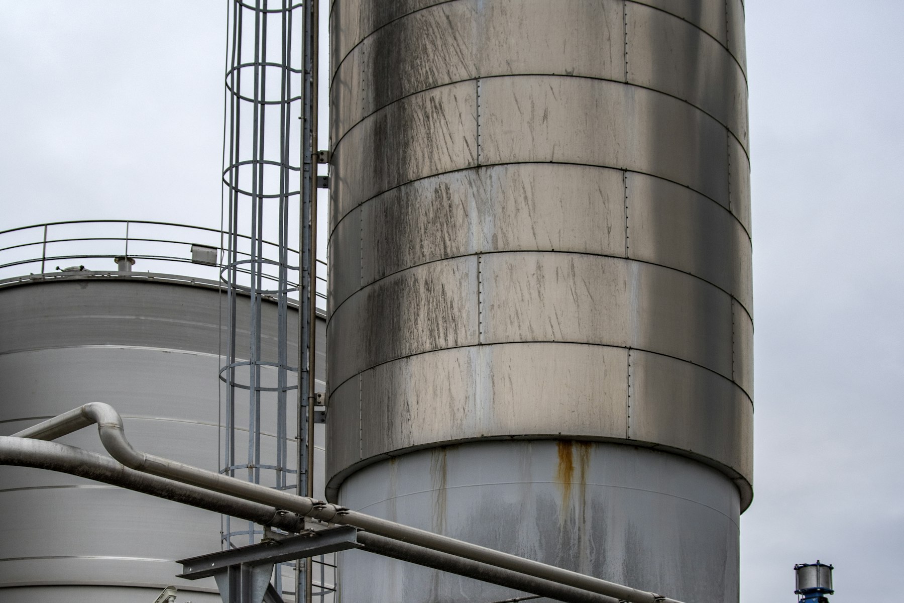 Gray industrial factory and manufacturing plant exterior under an open sky